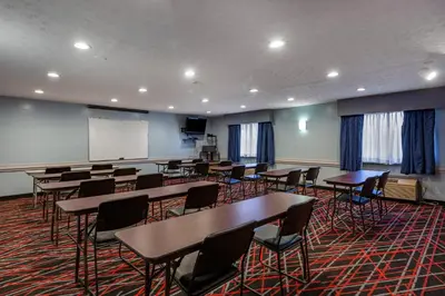 a classroom with desks and chairs and a whiteboard at Quality Inn Austintown-Youngstown West in Youngstown