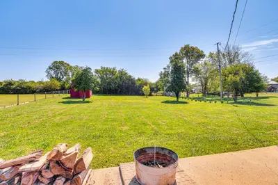 a fire pit with a field in the background at 7 Mi to Depot District Richmond Home with Fire Pit in Richmond