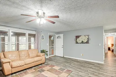 a living room with a couch and a ceiling fan at Spacious Delaware Home with Game Room! in Delaware