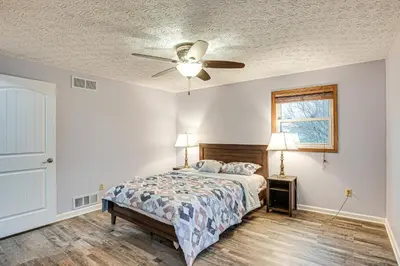 a bedroom with a bed and a ceiling fan at Spacious Delaware Home with Game Room! in Delaware