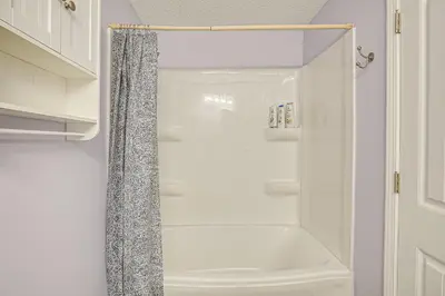 a white shower with a shower curtain in a bathroom at Spacious Delaware Home with Game Room! in Delaware