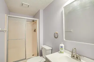 a bathroom with a shower and a toilet and a sink at Spacious Delaware Home with Game Room! in Delaware