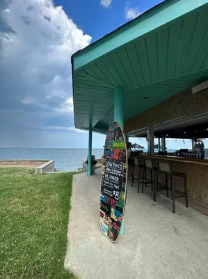 a skateboard parked under a building next to the ocean at Bayshore Resort At Put-In-Bay in Put-in-Bay