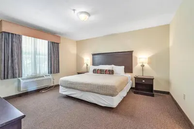 a hotel room with a bed and a window at Kelleys Island Venture Resort in Kelleys Island