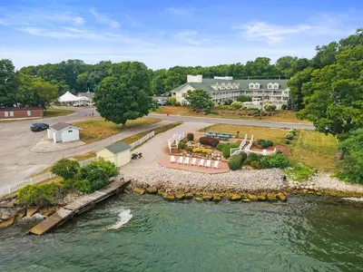 an aerial view of a house next to a river at Kelleys Island Venture Resort in Kelleys Island