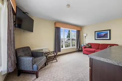 a hotel room with a living room with a couch at Kelleys Island Venture Resort in Kelleys Island