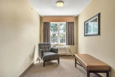 a waiting room with a chair and a window at Kelleys Island Venture Resort in Kelleys Island