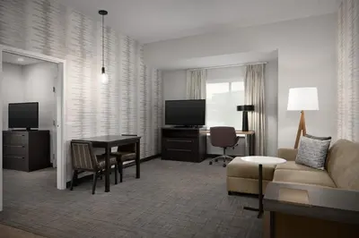a living room with a couch and a table at Residence Inn by Marriott Kenwood Cincinnati in Kenwood