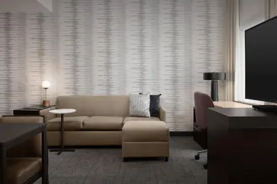 a living room with a couch and a tv at Residence Inn by Marriott Kenwood Cincinnati in Kenwood