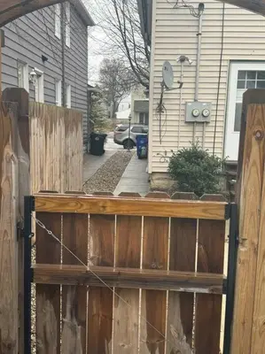 a wooden fence in front of a house at Little house on 47th in Cleveland