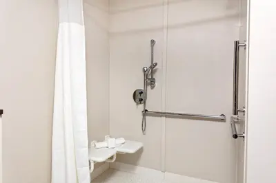 a bathroom with a shower and a sink at Fairfield by Marriott Port Clinton Waterfront in Port Clinton