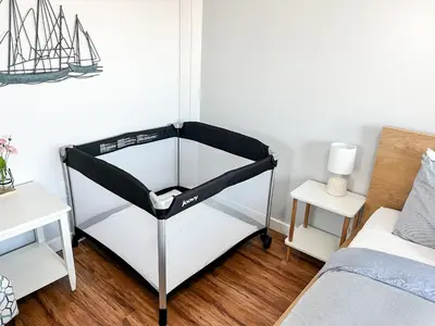 a black and white bunk bed in a bedroom at Anchors Away - Relaxing Cottage Minutes from Lake in Buckeye Lake