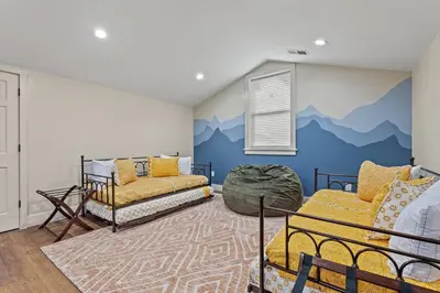 a bedroom with a mountain mural on the wall at New Barndo/Private River Access/ 2 Private Hot Tub in Stanton