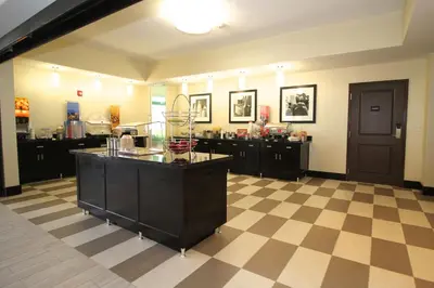 a large room with a counter and a checkerboard floor at Hampton Inn and Suites Sandusky/Milan in Milan