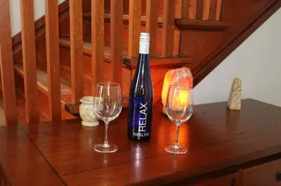 a bottle of wine and two glasses on a table at 5 minutes by car to OU, 2 Bedroom, 1.5 bath, Wi-Fi in Athens