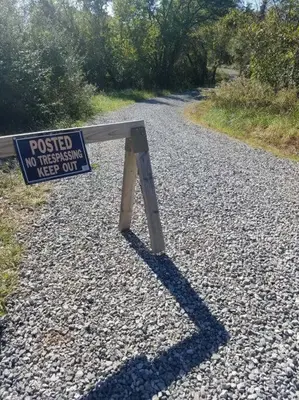 a sign on the side of a gravel road at 5 minutes by car to OU, 2 Bedroom, 1.5 bath, Wi-Fi in Athens