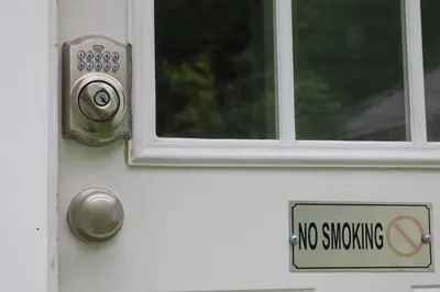 a no smoking sign on a white door with a window at 5 minutes by car to OU, 2 Bedroom, 1.5 bath, Wi-Fi in Athens
