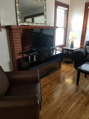 a living room with a fireplace and a couch at 5 minutes by car to OU, 2 Bedroom, 1.5 bath, Wi-Fi in Athens