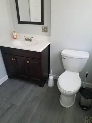 a bathroom with a white toilet and a sink at 5 minutes by car to OU, 2 Bedroom, 1.5 bath, Wi-Fi in Athens