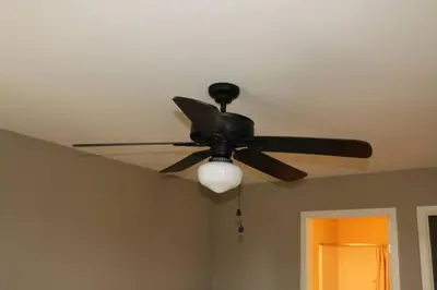 a ceiling fan with a light on a ceiling at Athens city townhouse, 3 bedroom, 2.5 baths, Wi-Fi in Athens