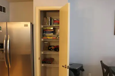 a door open to a kitchen with a refrigerator at Athens city townhouse, 3 bedroom, 2.5 baths, Wi-Fi in Athens
