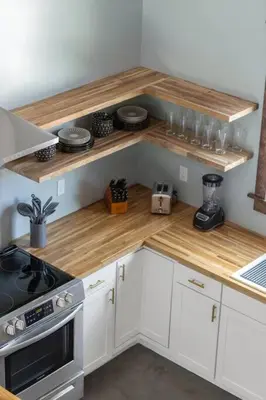 a kitchen with white cabinets and a wooden counter top at New Barndo/Kayak Launch/ 2 Private Hot Tubs in Stanton