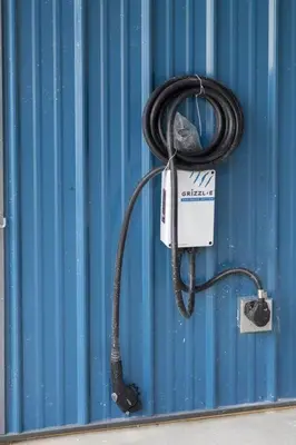 a black cord hooked up to a blue wall at New Barndo/Kayak Launch/ 2 Private Hot Tubs in Stanton