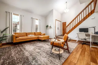 a living room with a couch and a table at Quiet 2-Bedroom Condo with Garage and Fast Wi-Fi in Fort Wayne