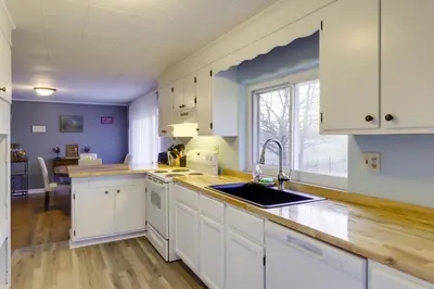 a kitchen with white cabinets and a sink at Pet-Friendly Union Home about 19 Mi to Cincinnati! in Union