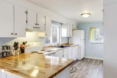 a kitchen with white cabinets and a counter top at Pet-Friendly Union Home about 19 Mi to Cincinnati! in Union