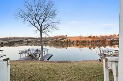 a dock in the middle of a lake at Lakefront, Private Covered Dock, Huge Balconies in Williamstown