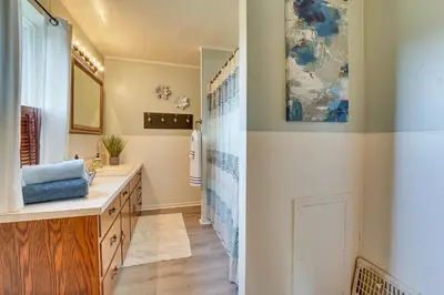a bathroom with a sink and a mirror at Meet Country Animals! Farmyard Stays Dundee Home in Dundee