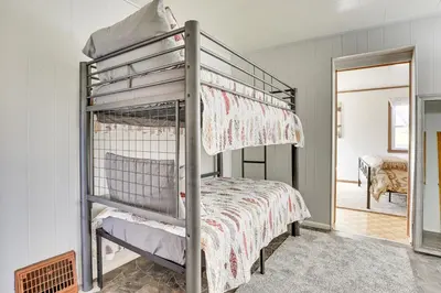 a bunk bed in a room with a bed at Meet Country Animals! Farmyard Stays Dundee Home in Dundee