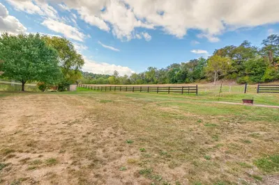 a field with a fence and a tree at Meet Country Animals! Farmyard Stays Dundee Home in Dundee