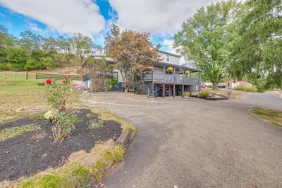 a large house with a driveway in front of it at Meet Country Animals! Farmyard Stays Dundee Home in Dundee
