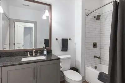 a bathroom with a toilet and a sink and a shower at Charming 1BR 1BA Apartment Near Downtown Cincinnati in Cincinnati
