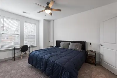 a bedroom with a bed and a ceiling fan at Charming 1BR 1BA Apartment Near Downtown Cincinnati in Cincinnati