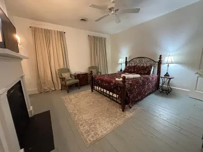 a bedroom with a bed and a ceiling fan at 
