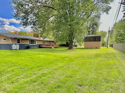 a yard with a house and a tree at Charming Spacious Get Away in Shelbyville