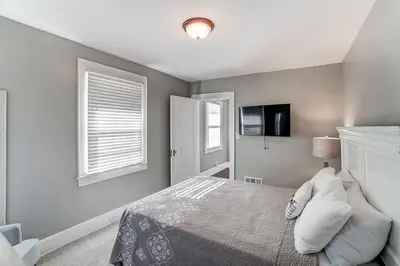 a bedroom with a bed and a television in it at Beautiful Equestrian Estate home w/ Hot Tub! in Loveland