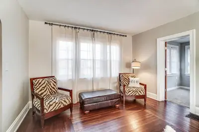 a living room with two chairs and a window at Beautiful Equestrian Estate home w/ Hot Tub! in Loveland