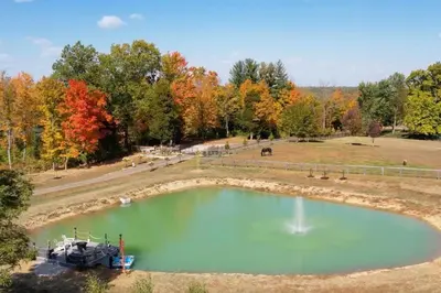an aerial view of a large pond in a park at Beautiful Equestrian Estate home w/ Hot Tub! in Loveland