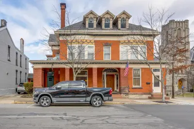 a black truck parked in front of a house at Historic Tiffin Home about Half Mi to University! in Tiffin