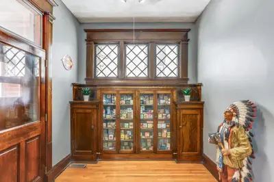 a home entry with a wooden door and a window at Historic Tiffin Home about Half Mi to University! in Tiffin