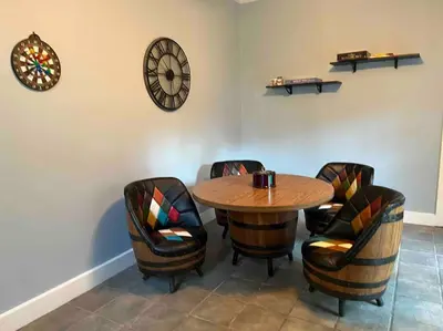 a dining room with a wooden table and chairs at Madison Manor II by the River Hot Tub Downtown in Madison