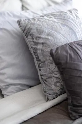 a pillow sitting on top of a bed at Luxury Downtown Townhome Unit 13 in Cleveland