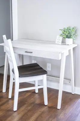 a white desk with a chair and a plant at Luxury Downtown Townhome Unit 13 in Cleveland