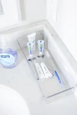 a drawer with toothbrushes and toothpaste in a refrigerator at Luxury Downtown Townhome Unit 13 in Cleveland