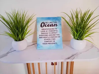 two potted plants on a table with a book at Ocean Palace -12 Guests- close to I-75-Amazing Location!! in Maud