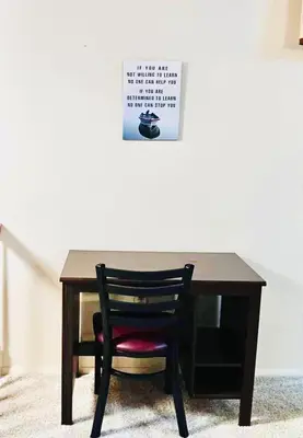 a black desk with a chair and a sign on the wall at Ocean Palace -12 Guests- close to I-75-Amazing Location!! in Maud